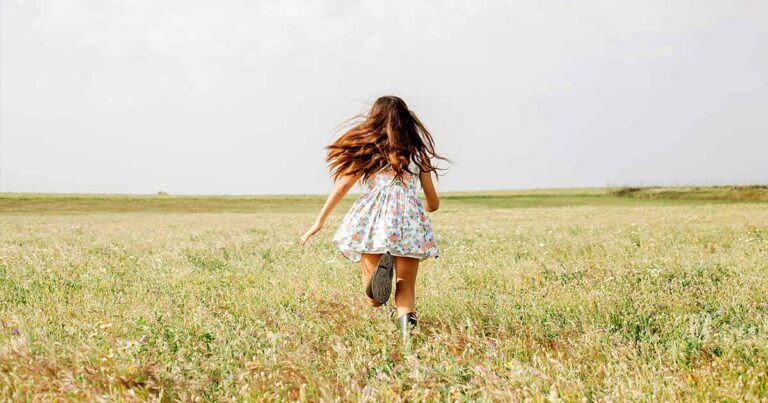 girl-cute-dress-running-field